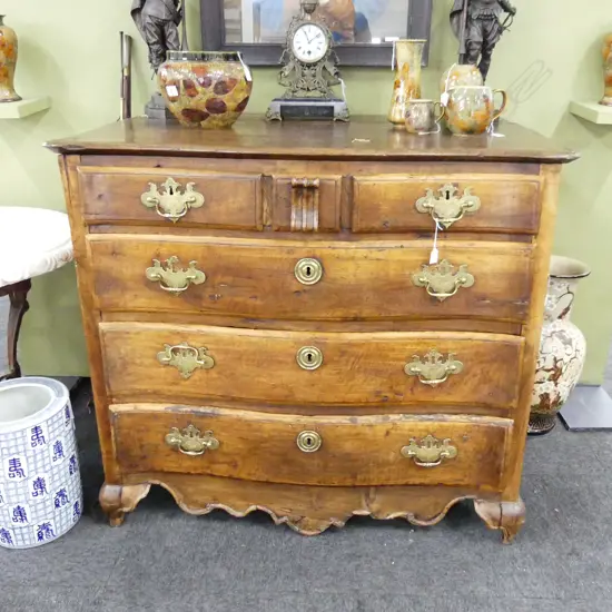A 19thC French provincial large fruitwood commode