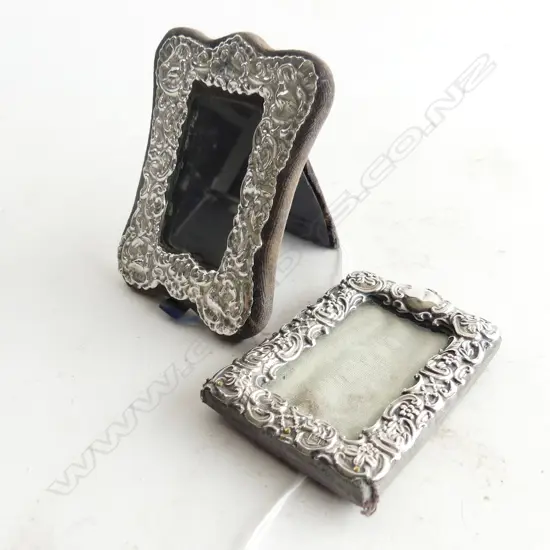 TWO SMALL ST. SILVER PHOTO FRAMES (ONE STRUT MISSING)