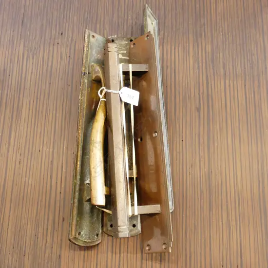 FOUR LARGE BRASS DOORPULLS WITH BACKPLATES. THREE BRASS L. 350mm  OTHER COPPER FINISH, IN DECO STYLE . L.355mm