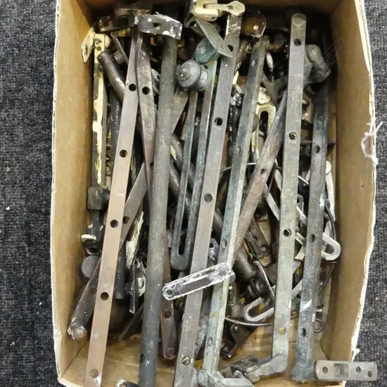 BOX LOT BRASS WINDOW CASEMENTS.