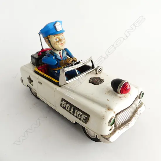 JAPANESE TIN PLATE POLICE CAR - MADE IN JAPAN BY NOMURA, C1950'S. BATTERY OPERATED L. 240MM