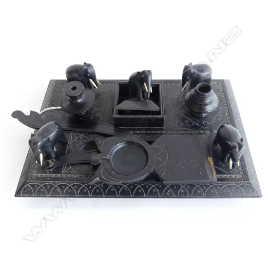EBONY DESKSET WITH FIVE CARVED ELEPHANTS. NEEDS SOME RECONSTRUCTION.