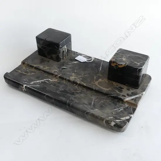 LARGE BLACK MARBLE DESKSET WITH ' VEINING ' IN WHITE AND BROWN. ONE INKWELL LID FAULTED. L.380mm