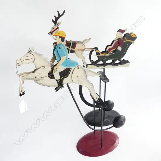 2 VINTAGE PAINTED METAL CONTER-BALANCED WEIGHT TOYS. SANTA IN SLEIGH & JOCKEY 0N HORSE H.450mm