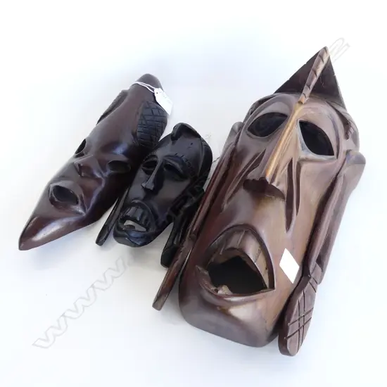 THREE AFRICAN CARVED MASKS. ONE EBONY .H. 380.280.170mm