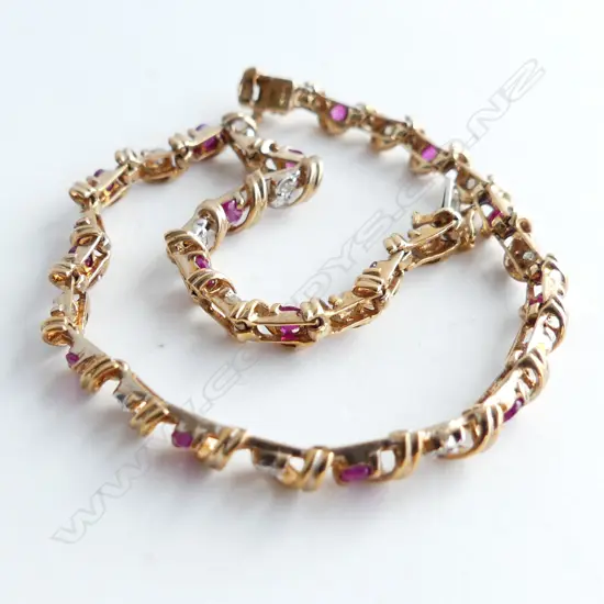 9CT GOLD DIAMOND AND RUBY TENNIS BRACELET 5.68gm