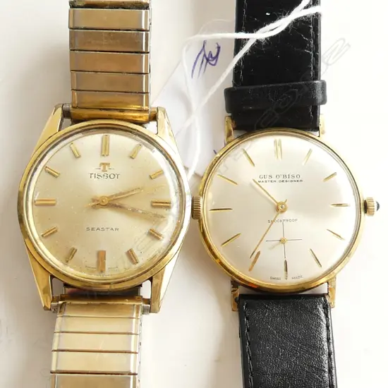 TWO MENS  MANUAL WIND 1960S WATCHES. TISSOT AND GUS OBISO. GOLD PLATED BOTH APPARENTLY WORKING.