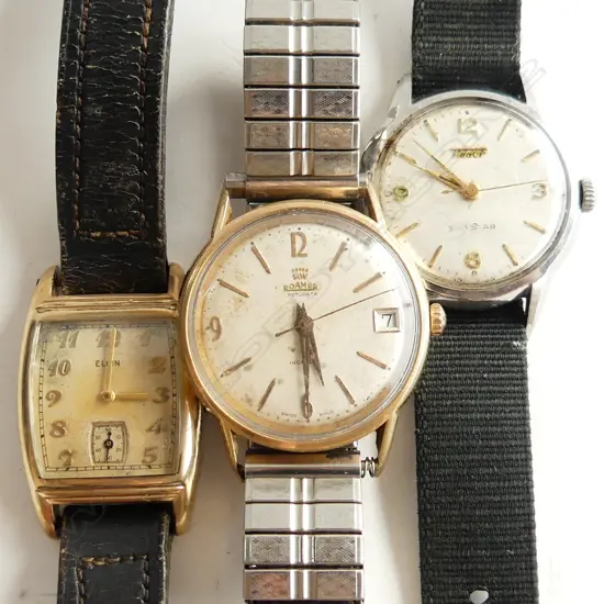 THREE MANUAL WIND WATCHES. ONE DECO STYLE GOLD PLATED ELGIN .STAINLESS TISSOT & PLATED ROAMER.