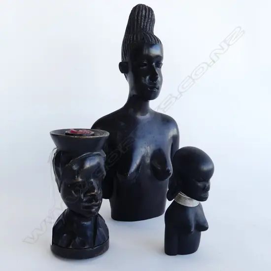 THREE CARVED EBONY AFRICAN FEMALE BUSTS. H.270. 130. 110mm
