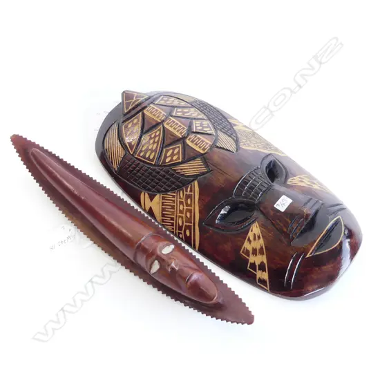 TWO CARVED WOODEN TONGAN  MASKS BOTH H. 350mm