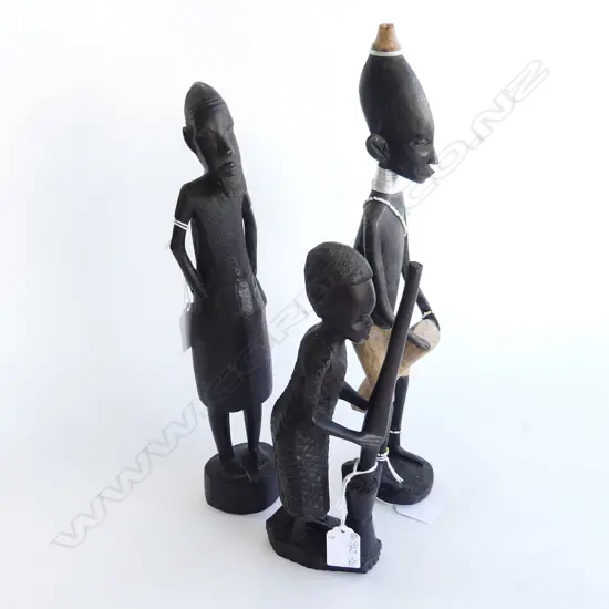 THREE AFRICAN EBONY FIGURES. ONE DRUMMER H. 370mm ONE POUNDING H. 250mm  OTHER WISEMAN H.340mm