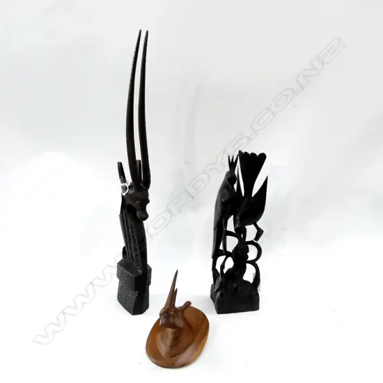 THREE CARVED ANIMALIA ITEMS. RHINO BUST H.120mm AFRICAN SCIMITAR ONYX H.470mm & TWO CARVED BIRDS ON A BRANCH H. 300mm