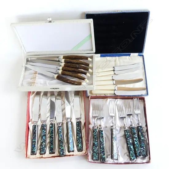 FOUR SETS OF BOXED CUTLERY. FORKS &KNIVES WITHN PAUA GRIPS BUTTER KNIVES AND ' ANTLER' STEAKKNIVES. 