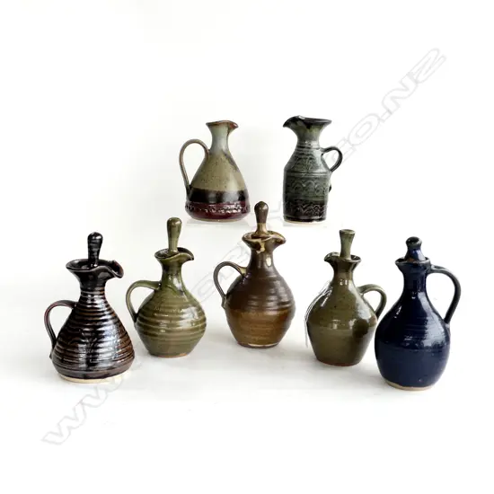 7 SML NZ POTTERY JUGS WITH POTTERS MARKS. H.13-17MM