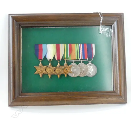 FRAMED WWII SERVICE MEDAL GROUP INCLUDING THE AFRICA  ATLANTIC AND PACIFIC STAR
