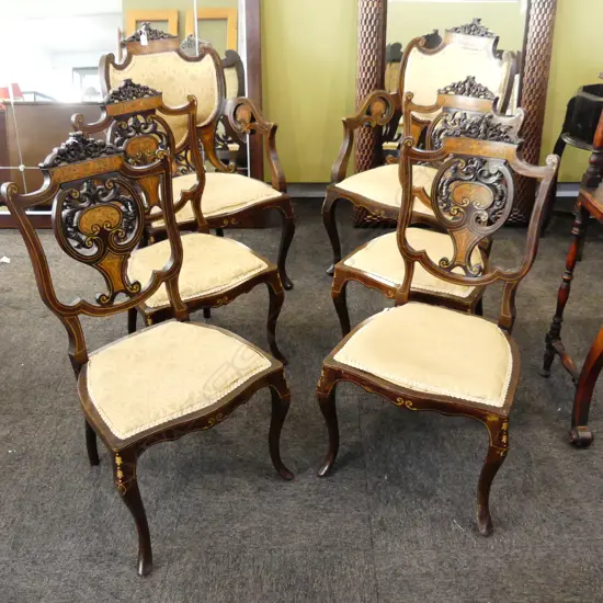 Edwardian period. All chairs with typical boxwood stringing, heavily carved crest and central splat with ' C' scrolls. On cabriole legs..  The  carvers also with C scrolls to the arms.
