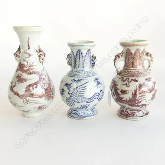 3 ORIENTAL POTTERY VASES; 2 WITH RED DRAGONS (H. 210, 170mm) & ONE BLUE & WHITE (H. 170mm)