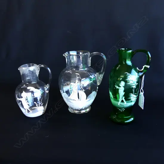 3 MARY GREGORY VICTORIAN GLASS JUGS – TWO WITH CHILDREN, ONE WITH SHIP