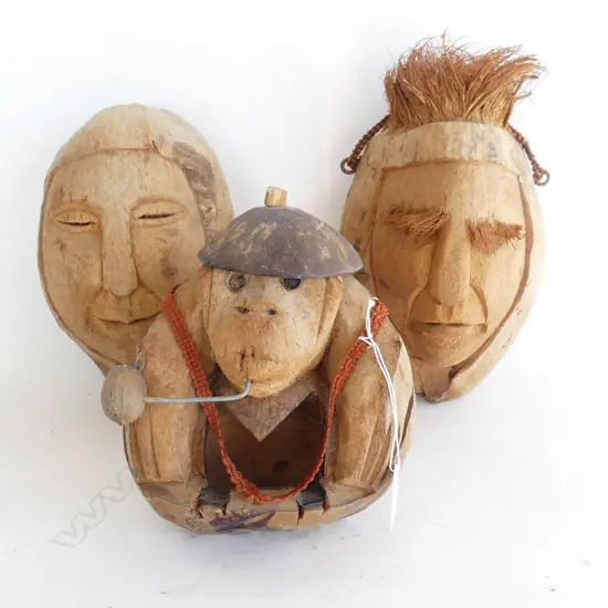 3 PACIFIC ISLAND FOLK ART CARVED COCONUTS, 2 FACE WALL MASKS & ONE MONKEY WITH PIPE 