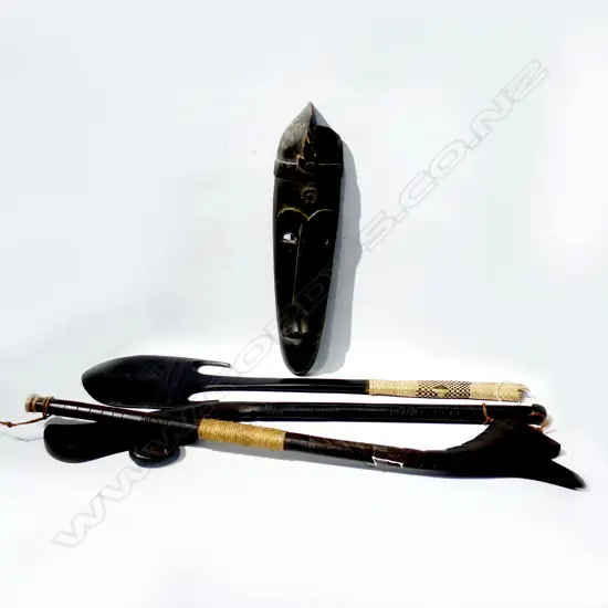 4 CARVED WOODEN TRIBAL PCES; 3 CLUBS L.1020mm + MASK H.575mm