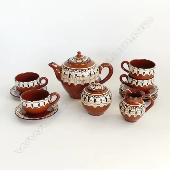 12 PCE SLIP DECORATED TEA SET; TEAPOT, 5 SAUCERS, 4 CUPS, MILK & SUGAR (CHIPS)