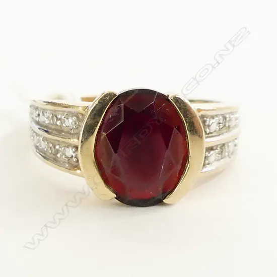  9CT GOLD GARNET RING WITH 4 SMALL DIAMONDS 5GMS