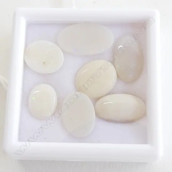 SEVEN 15CT OVAL MILKY OPALS