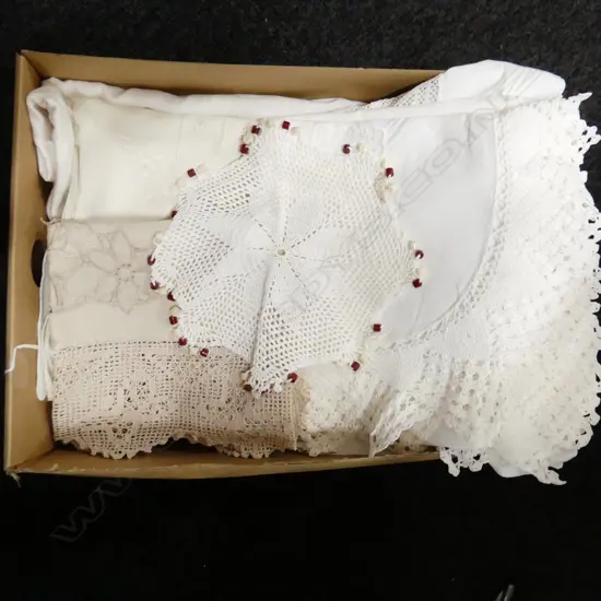 APPROXIMATELY FIVE OLD EMBROIDERED TABLECLOTHS AND DOILIES.