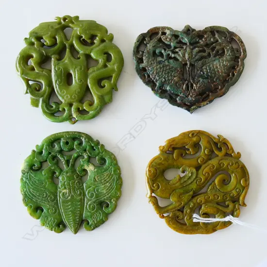 FOUR JADE / JADEITE AMULETS
