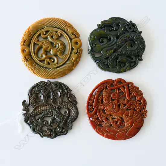 FOUR JADE / JADEITE AMULETS