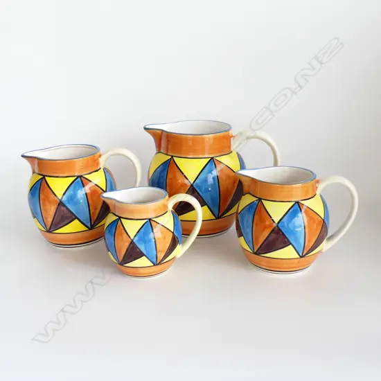 4 REPRODUCTION GRADUATING CLARICE CLIFF BIZARRE JUGS H.185mm