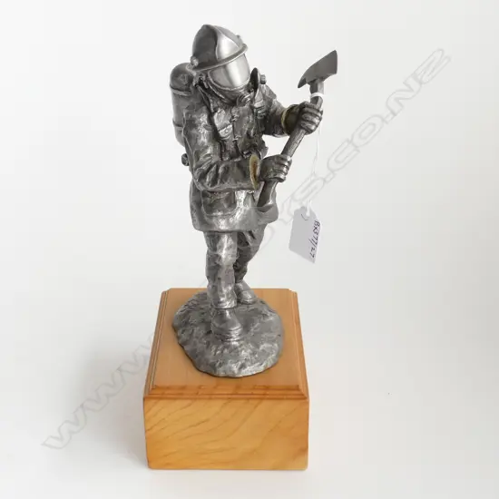 PEWTER FIGURE OF FIREMAN WITH AXE INITALED GM HEIGHT ON WOOD BASE 270MM