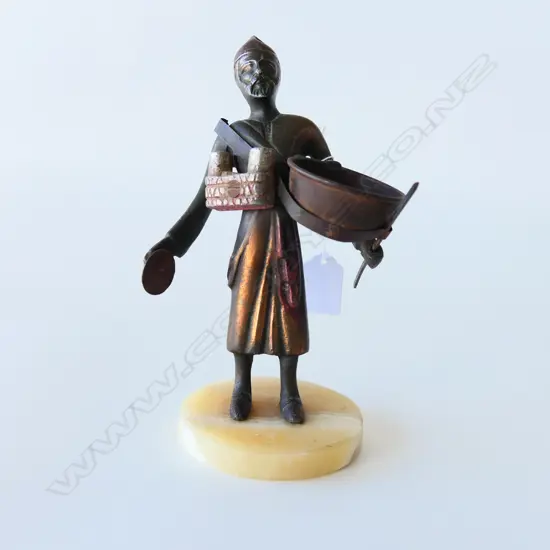 BRONZED SPELTER FIGURE OF A TRADER