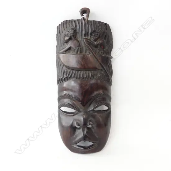 AFRICAN CARVED EBONY MASK figures in canoe to the top H.460mm.