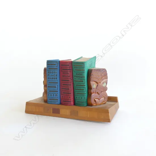 SET OF 3 MINIATURE REED MAORI BOOKS; PLACE NAMES, MAORI / ENGLISH, PROVERBS + INLAID WOODEN STAND W.110mm
