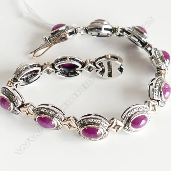 SILVER AND GOLD DIAMOND AND RUBY BRACELET (one diamond missing)