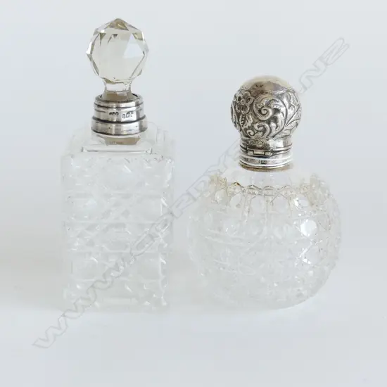 2 LG VINTAGE CUT GLASS SCENT BOTTLES, 1 WITH STG SILVER LID (H. 120mm) 1 WITH STG COLLAR & GLASS STOPPER (H.140mm)