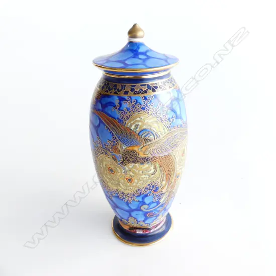 CARLTON WARE LIDDED VASE; GILT DESIGN ON BLUE GROUND H.180mm chip to tip