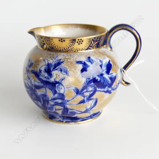 A late Victorian Doulton Burslem jug of squat spherical shape decorated in colours of blue