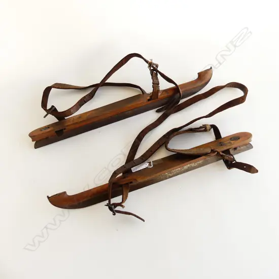 PAIR OF ANTIQUE WOODEN ICE SKATES WITH STEEL BLADES AND LEATHER FITTINGS STAMPED 2160 L. 410mm