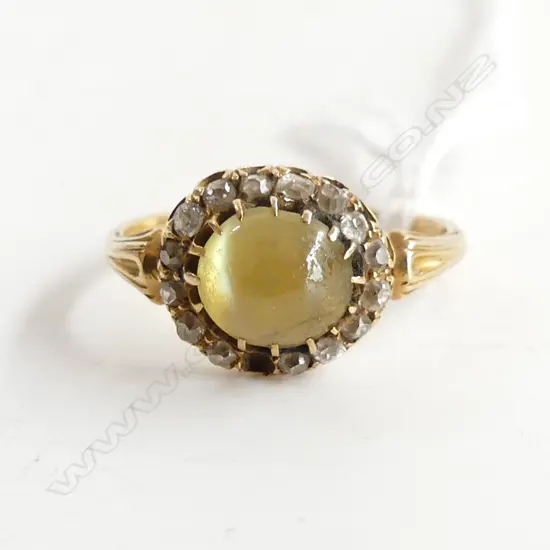 18CT RING WITH MOONSTONE (?) & DIAMONDS  3.48GMS a/f (diamond missing)