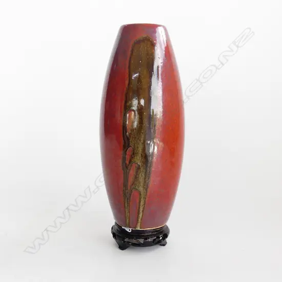 ORIENTAL RED GLAZED VASE WITH WOODEN STAND H. 260mm