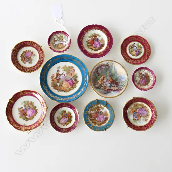 11 SMALL LIMOGES PLATES.