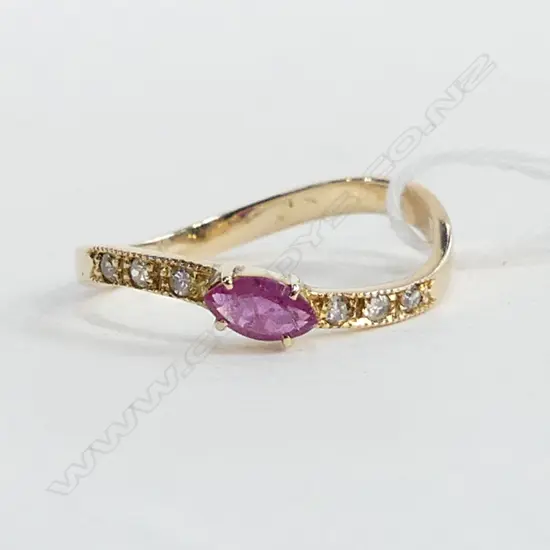 9CT GOLD RUBY & DIAMOND SET TWIST RING, 1.46GMS