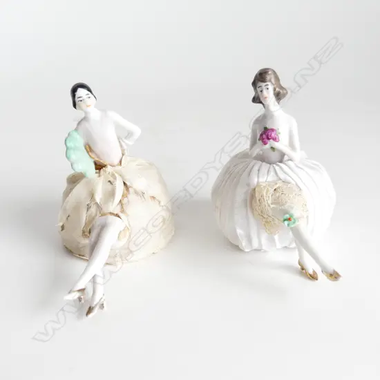 TWO ANTIQUE HALF DOLL PIN CUSHIONS WITH LEGS – ONE ART DECO WITH GARTER, ONE WITH FAN H. 80mm