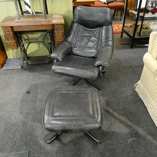 RECLINING BLACK LEATHER CHAIR & FOOTSTOOL