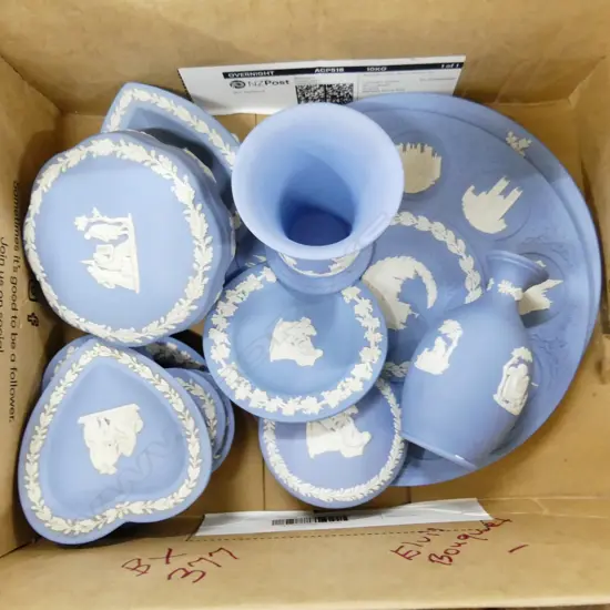 BOX LOT WEDGWOOD BL/WHITE BASE RELIEF CHINA. INCLUDES TWO PLATES SMALL DISHES VASE AND JEWELLERY BOX.