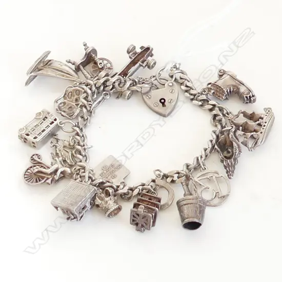 STG SILVER CHARM BRACELET 54.7 GRAMS