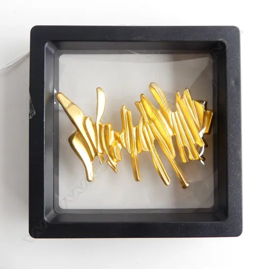 UNUSUAL GOLD GILDED BROOCH IN DISPLAY CASE WITH STAND 