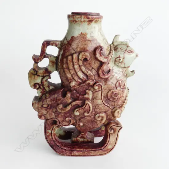 MOTTLED BROWN JADE WINE VESSEL WITH BIRD HEAD DECORATION.